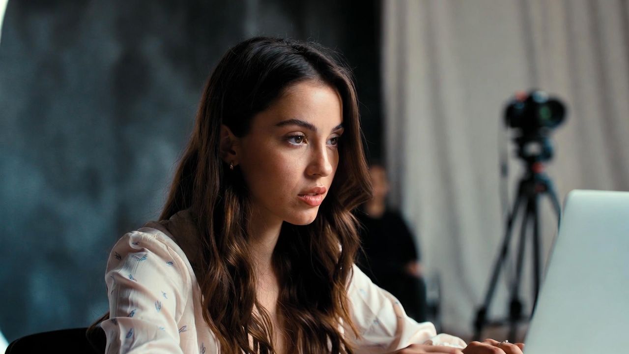 Person using phone in a calm, mindful setting with soft natural lighting